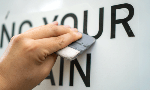 transfer cur decal being applied using a squeegee tool